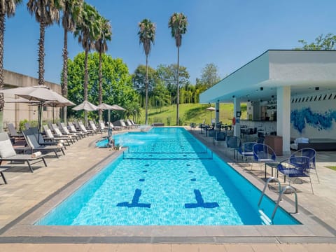 Outdoor pool, pool umbrellas, sun loungers