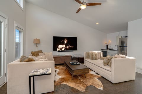 Additional living space (3rd floor) with smart TV and wet bar.