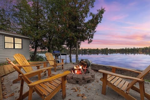 Outdoor seating around the firepit with a great view of the lake