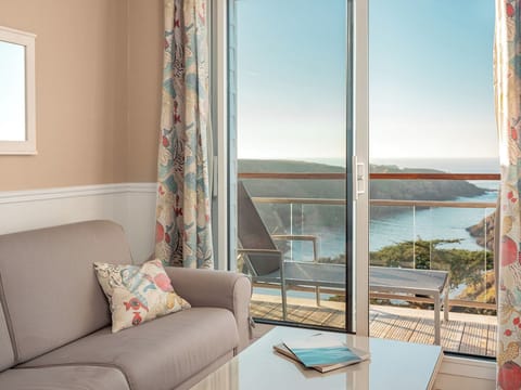 Suite, Sea View | Living area | Flat-screen TV