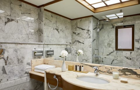 Shower, designer toiletries, hair dryer, bathrobes