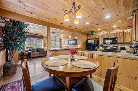 View of the dining table kitchen and living room