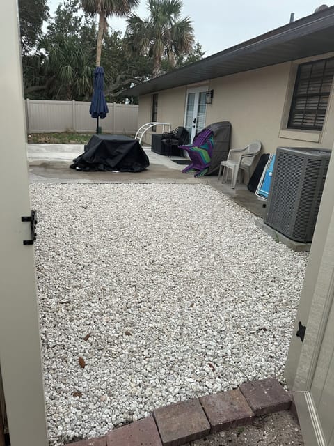 Patio view from exterior fence entrance 