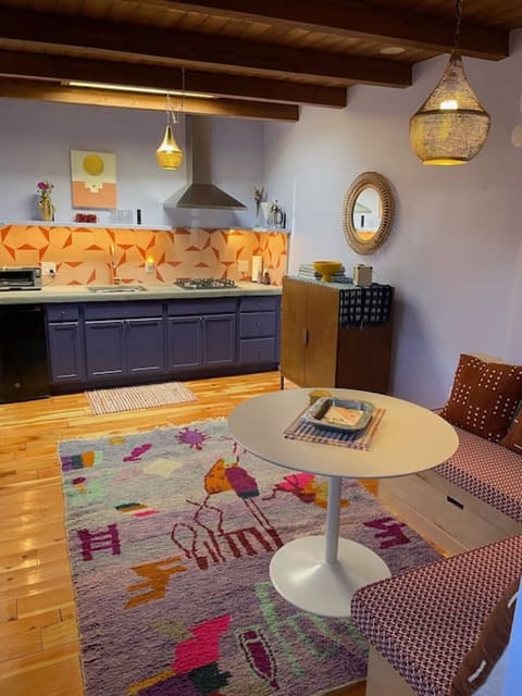 Dining/sitting area with built-in nook. All of our furniture is either upcycled or built and upholstered by local artisans.