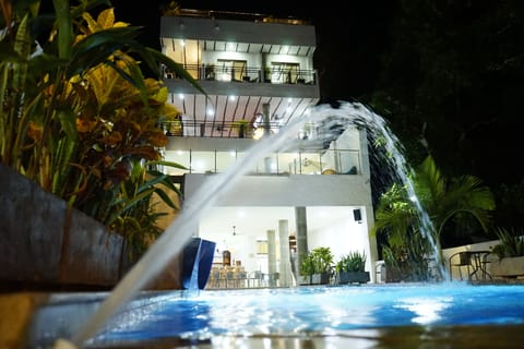 Outdoor pool, open 9:00 AM to 10:00 PM, pool umbrellas
