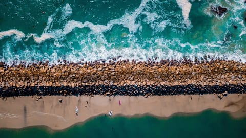 Beach nearby, white sand, sun loungers, beach towels