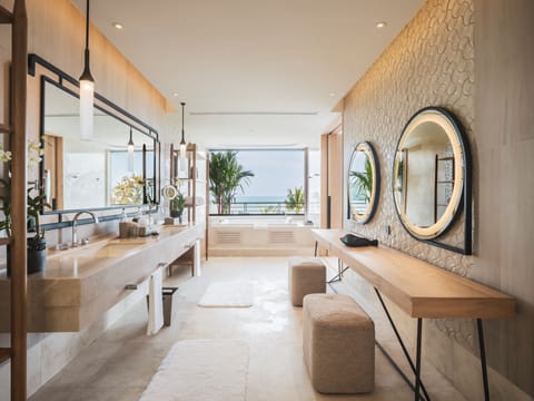 Designer toiletries, hair dryer, bathrobes, slippers