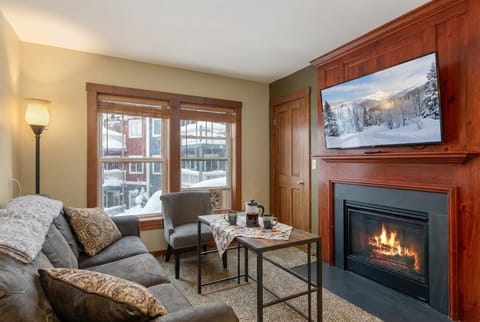 Cozy up by the fireplace in this inviting living room.  Here's what other guests have to say: Colleen McGovern:  "The condo was spotless and matched the description and photos perfectly. I wou