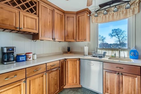 Enjoy the full kitchen with a refrigerator, freezer, oven, stove, microwave, dishwasher, coffee, creamers, mixers, spices, pots, pans, cooking supplies, cutlery, cups, plates, bowls, utensils, small appliances, and many more essentials!