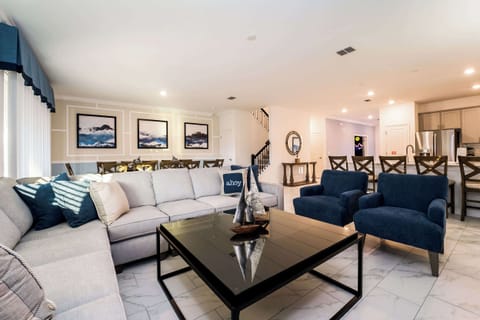 Relax in this elegant living space with plush seating and modern decor, perfect for gatherings and relaxation.