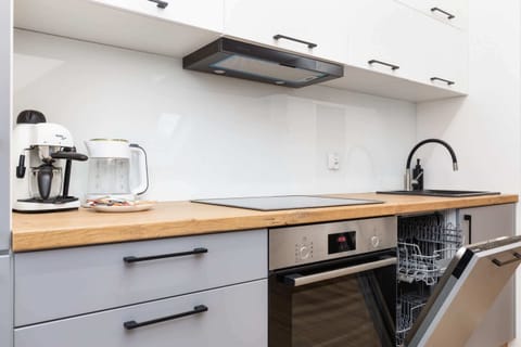 A well-equipped kitchen with modern appliances, including a kettle and toaster.

