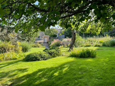 English country garden surrounds the front of the cottage 