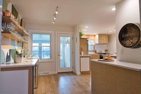 Directly next to the Lounge is our wetbar to the left, kitchen and coffee counter to the right.  Keep your beverages cold in the cooler under the bar counter.