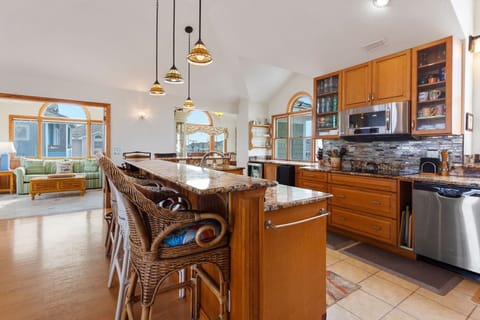 Cook up your favorite seafood feast in the Gourmet Kitchen with 2 Dishwashers, 2 Ovens, a 5-Burner Cooktop, Freestanding Ice-maker, and a Wine Cooler.