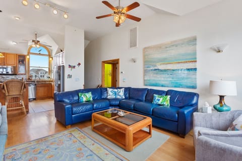 Relax in the beautiful Main Living Area with access to the Oceanfront Furnished Sun Deck. (Note: Fireplace is not for guest use)