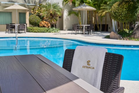 Outdoor pool, open 9 AM to 9 PM, pool umbrellas, sun loungers
