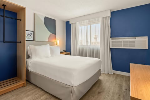 Room, 1 Queen Bed, Accessible (Mobility & Roll-In Shower) | Laptop workspace, blackout drapes, iron/ironing board