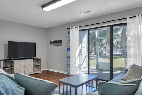 Living room area and easy access to the pool and courtyard