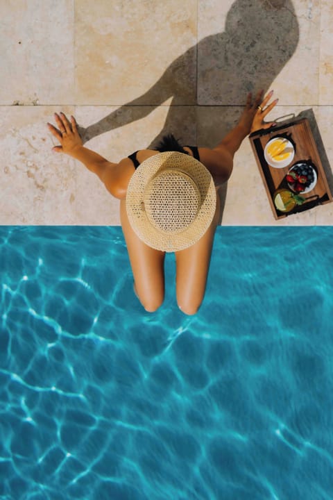 Outdoor pool, open 6:00 AM to 10:00 PM, sun loungers