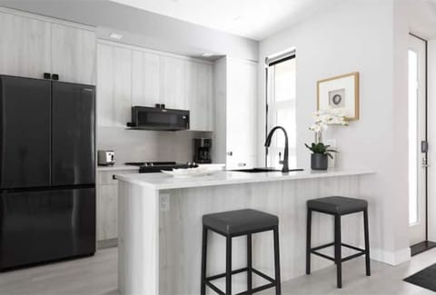 The kitchen island, great for sitting and conversing while making a meal.