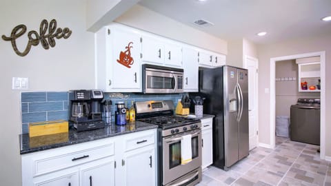 Wow! Look at this beautiful kitchen! Our kitchen is well equipped with stainless steel appliances, as well as smaller tools and utensils – including a rice cooker/Instapot, waffle maker, toaster, hand mixer, blender, coffee makers, and teapot.