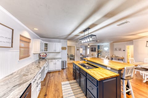 Full kitchen that opens to the dining room and living room