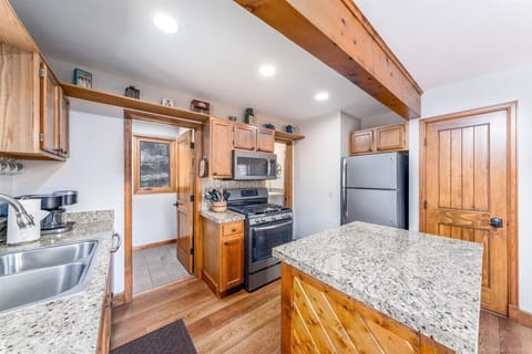 Fully equipped kitchen with granite counters, great appliances & gas stove. 