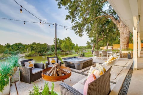 Outdoor living area with fire pit and hot tub at The Blanc Lake Granbury
