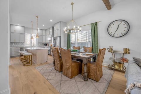 Gather around our elegant dining room table, perfect for hosting memorable meals and special occasions with loved ones during your stay."