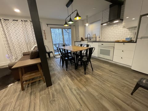 Table has sides that fold down to make it less obtrusive when in the kitchen