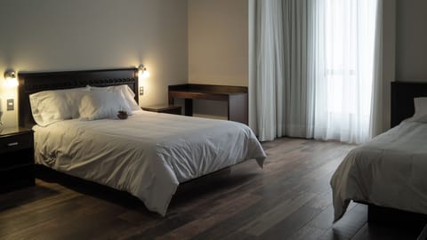 Premium bedding, down comforters, pillowtop beds, minibar