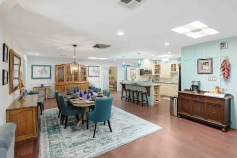 The dining area has a beautiful family table, breakfast bar and coffee station.