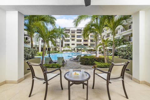 A ground floor porch to enjoy the pool view.
