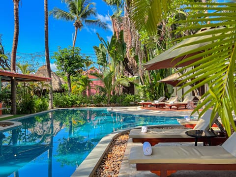 Outdoor pool, open 7:00 AM to 9:00 PM, pool umbrellas, sun loungers