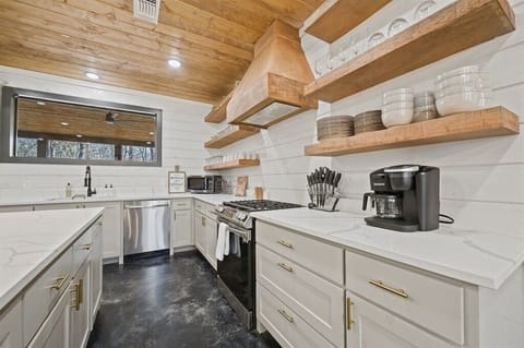Gourmet Kitchen: Whip up delicious meals with modern appliances and charming wood accents!