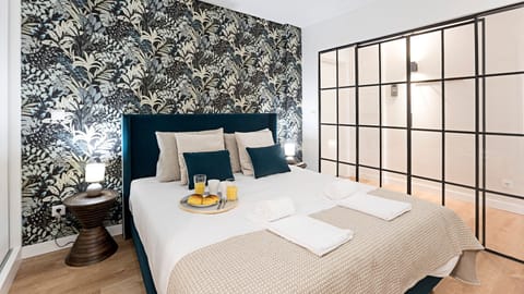 Gorgeous bedroom with sleek glass sliding doors — a stylish space that feels even more magical at night.

#nighttime #stylish #bedroomdesign #lovelystay