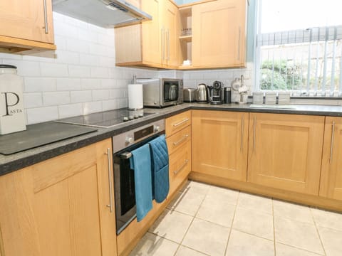 Fridge, electric kettle, cookware/dishes/utensils