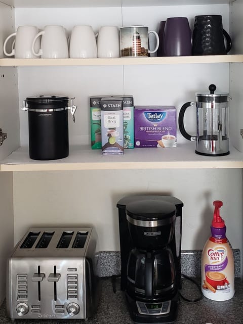 Drip coffee, tea, creamer, sugar are provided.