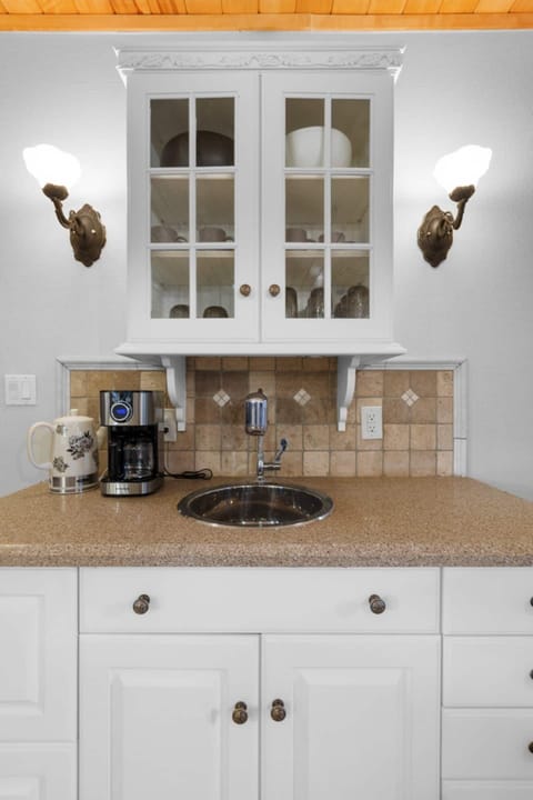 The spacious kitchen features a wet bar and coffee bar making morning prep easy and carefree. 