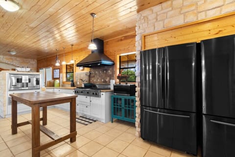 Main Lodge kitchen - A chef's dream! This kitchen features two XL fridges and a deep freeze, offering ample storage for all your culinary needs.
