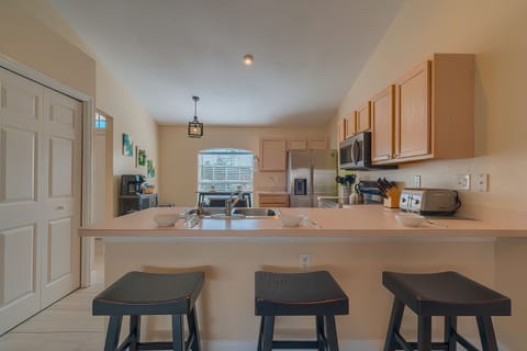 Have a few drinks at the kitchen bar while watching the designated chef in action. 