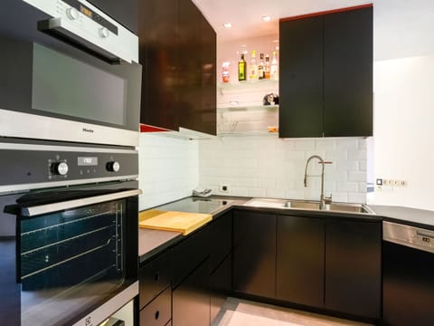 Villa | Private kitchen | Fridge, highchair