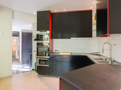 Villa | Private kitchen | Fridge, highchair