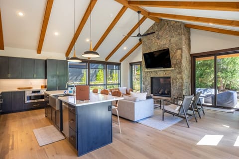 Open concept kitchen, dining and living areas