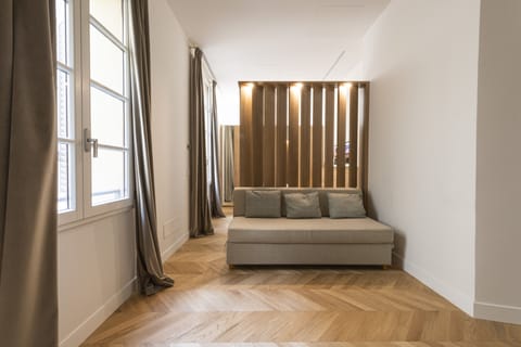 Deluxe Apartment | Living area | 40-inch flat-screen TV with digital channels, TV