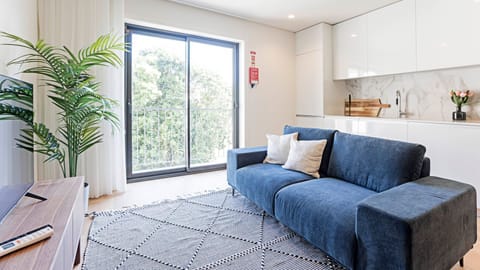 Living area with a sofa and balcony access! #cozy #balcony