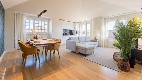 Gorgeously decorated main area with dining table, sofa-bed and fully equipped kitchenette #modern