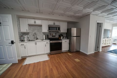 A bright and airy kitchen with a modern design and a touch of rustic charm. The perfect place to cook and create delicious meals.