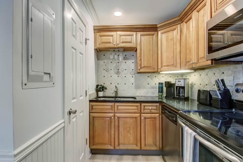 To the left is the door to the bathroom on this floor. The condo features 2 full bathrooms.