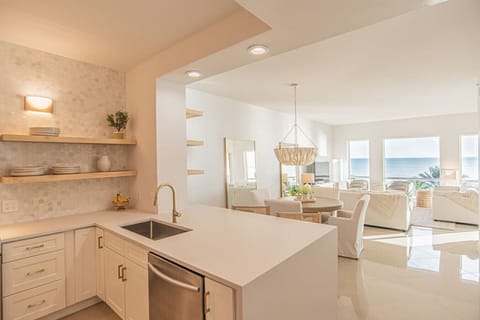 Kitchen, living, and dining in one open area.